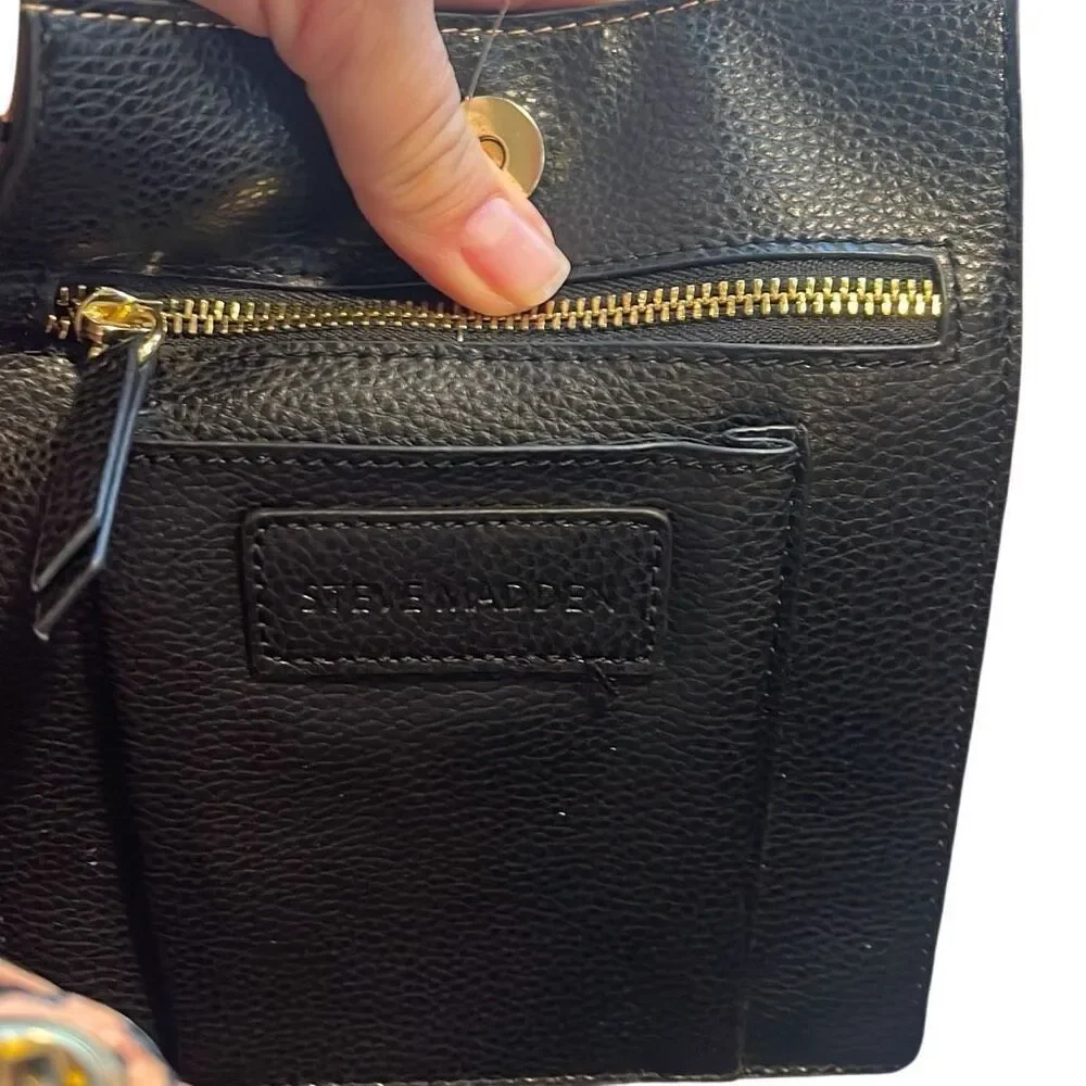 Steve  Madden Black tote, small flaw on top above nameplate